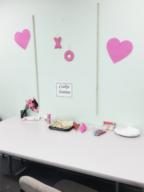 There are pink hearts with hugs and kisses in the middle